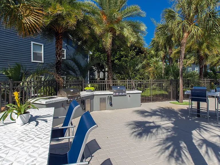 Our poolside outdoor kitchen is a perfect setting for shared meals under the sun.