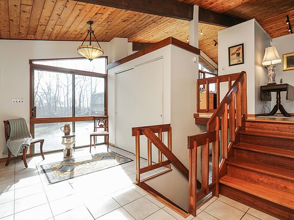 entrance hall with wall of windows overlooking the