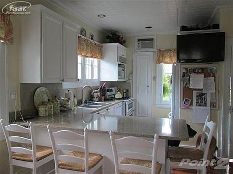 Kitchen with Quartz Countertops, Jen-Air appliances