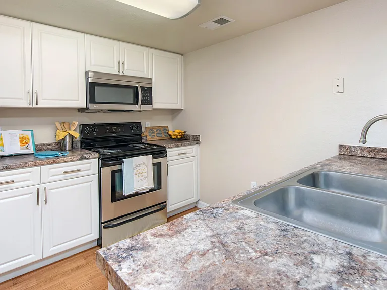 Indulge in our spacious, well-equipped kitchens, your hub for culinary creativity.