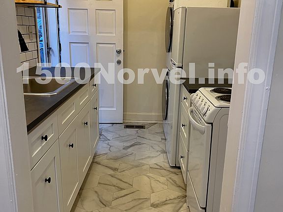 Updated kitchen and appliances including stackable washer and dryer