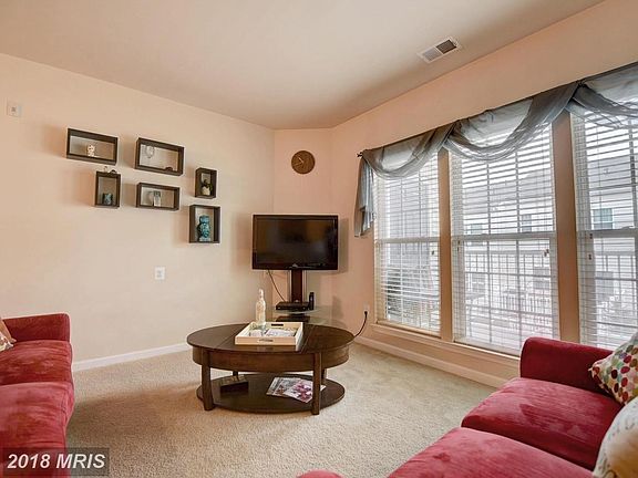 Spacious living room overlooks balcony
