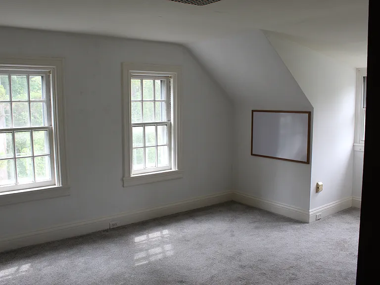 One of three spacious 3rd floor bedrooms
