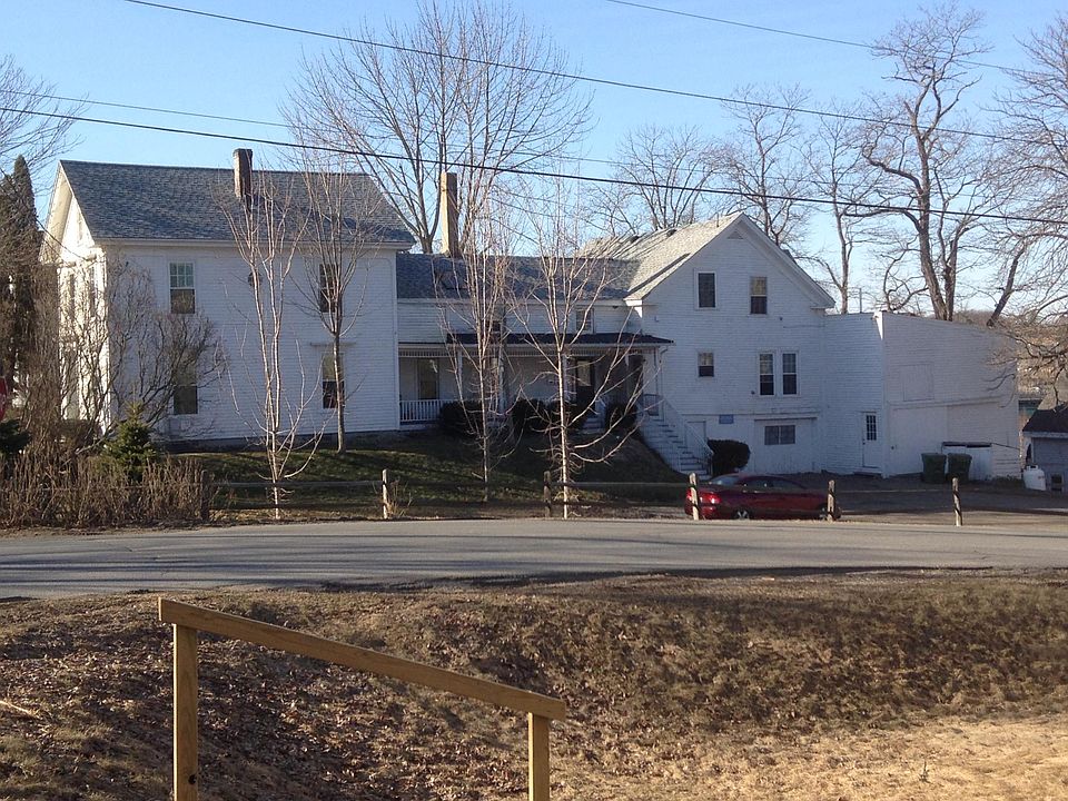Well maintained classic New England farmhouse. Unit 101 entrance is at center of the building. Parking just below stairs.