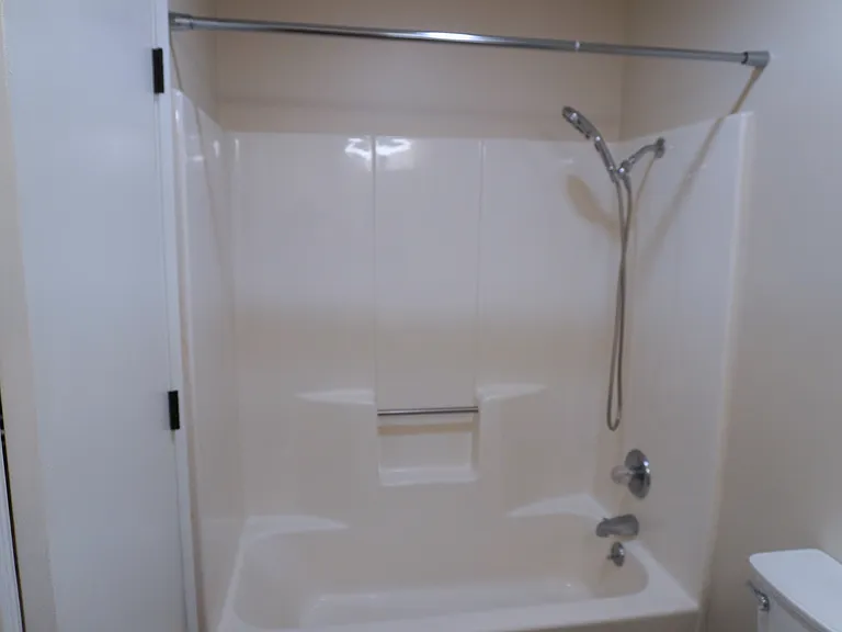 Hallway bathroom featuring a convenient tub/shower combination, perfect for relaxation and everyday use.