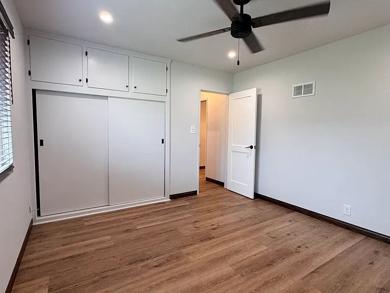 Large bedroom with closet and extra upper storage
