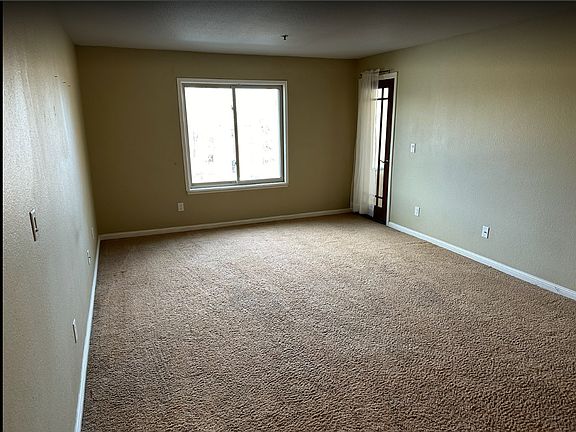 Living room connected to Covered Patio.