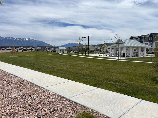 View from front of house. Pavilion to the left and then park and pool further to the left.