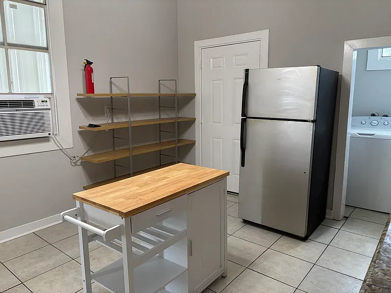 Kitchen leading to the back door with Washer and Dryer