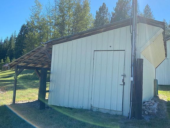 Wood shop with lean-to