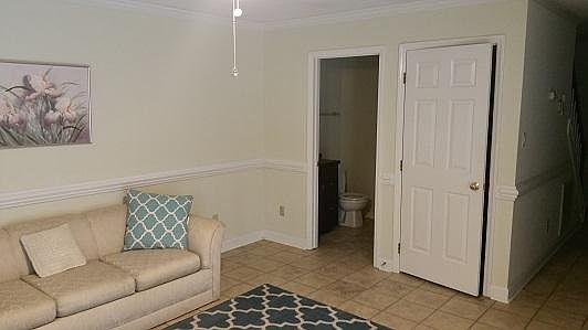 Half bathroom off living room, coat and storage closet