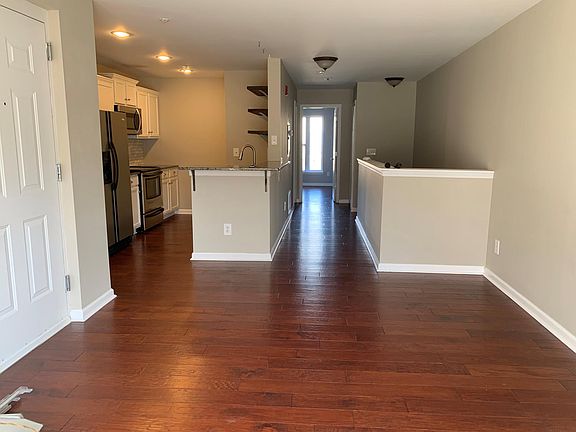 Living room/dining room, kitchen and hall to top floor bedroom.
