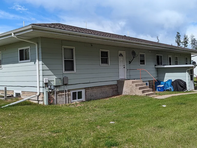 Rear of complex, door on right is entrance to lower level.