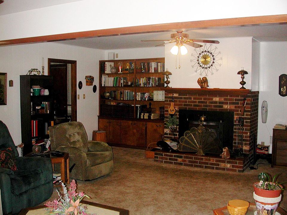 family room with wood burning fireplace