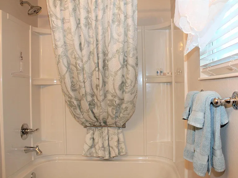 Guest bathroom with full shower/tub.