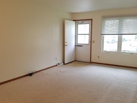 Large living room overlooking front deck and street