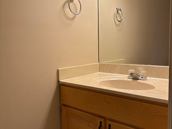 First floor half bathroom with porcelain tile
