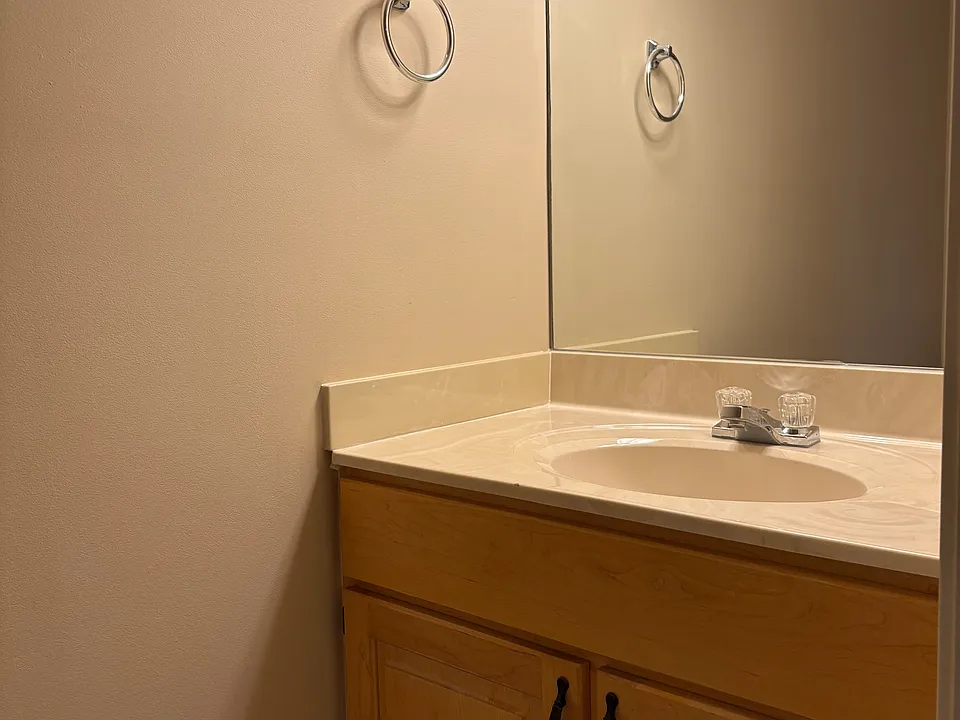 First floor half bathroom with porcelain tile