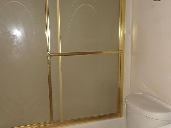 Bath with sliding glass door