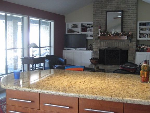 view from kitchen to great room with firplace