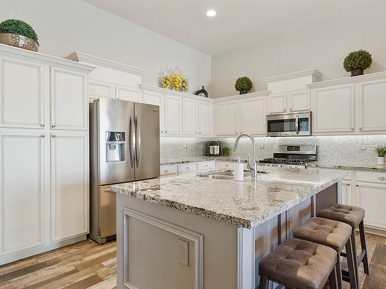 Open concept kitchen with dishwasher, microwave, gas stove and oven
