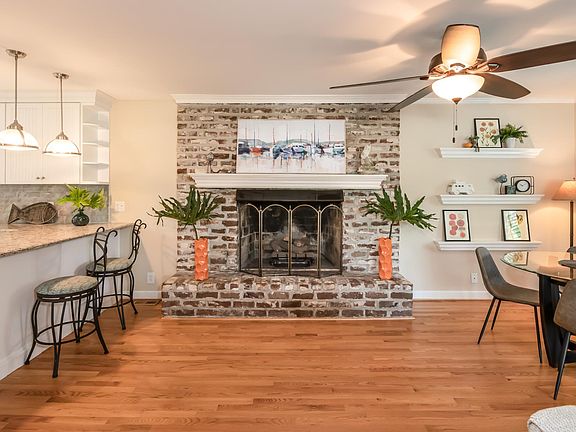 Living area with dining table for four and bar seating