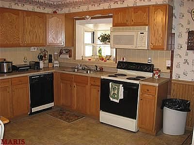 Updated eat in kitchen with garden window.