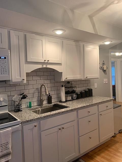 Brand new remodeled kitchen with subway tile backsplash & granite counters