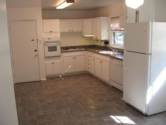 Large eat-in kitchen. Door leads the the attached garage. This pic shows about 1/2 of kitchen. See next pic.