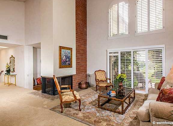 Living room with soaring wood beam ceilings