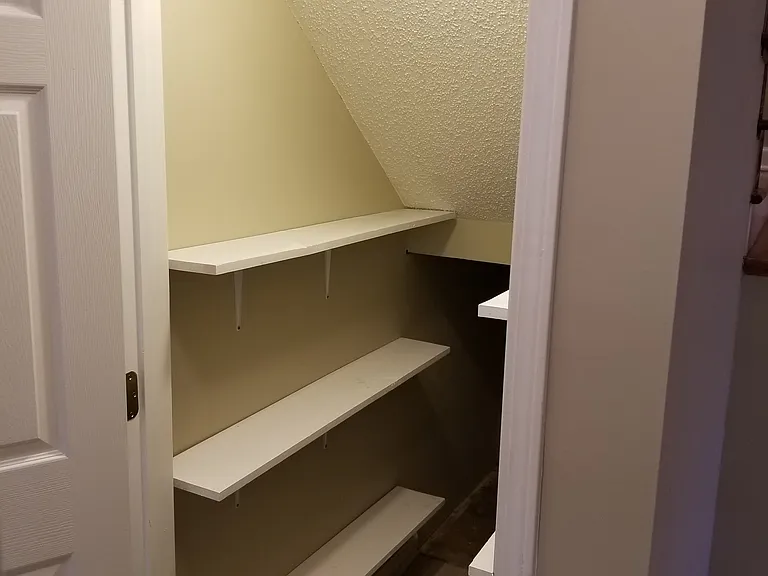 PANTRY/STORAGE ACROSS FROM KITCHEN