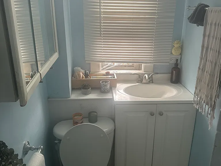 It features a simple but functional bathroom.