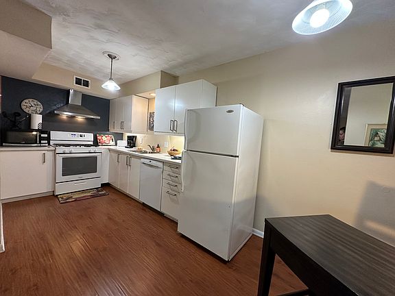 Open-concept layout featuring a seamless flow between the kitchen, living room, and dedicated workstation - perfect for both entertaining and productivity.