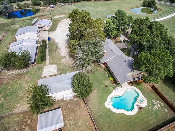 Home is conveniently located to barn, garage and workshop.