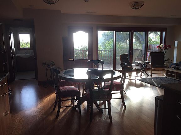 Eating area, bathroom is to the left, front door is where the light is blasting in