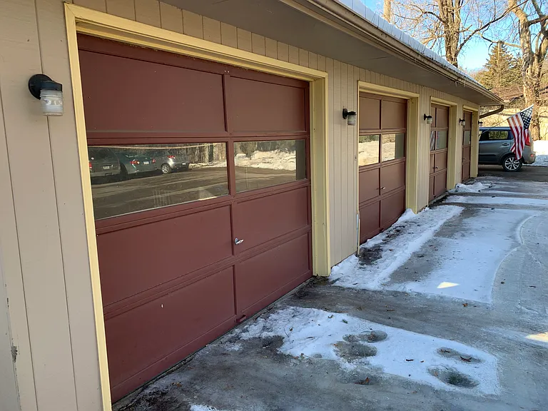 Four-car garage. Each condo comes with one private garage + one off-street parking stall