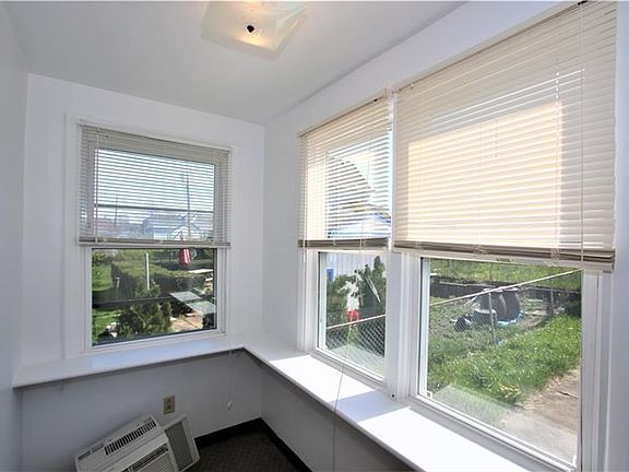 This 9x5 Bonus Den off of the Living Room is Shelved and Flooded with Natural Light from the Newer 3 Year Old Windows! Could be 