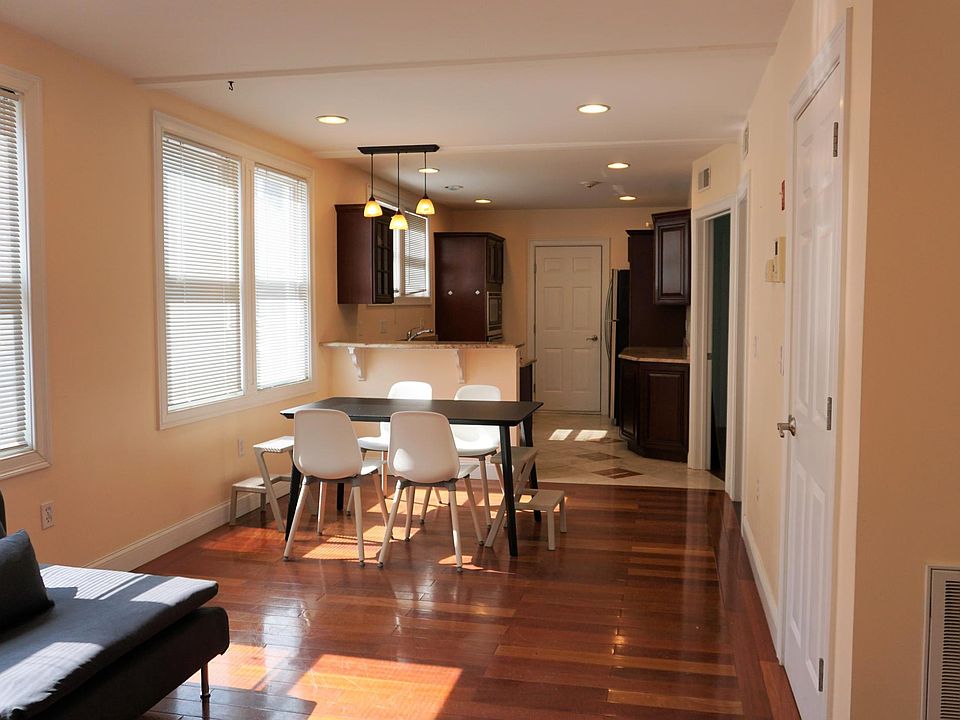 Dining room, kitchen beyond and living room in foreground
