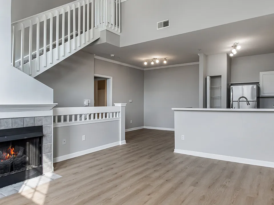 Enjoy an open-concept living space with modern finishes and a cozy fireplace.