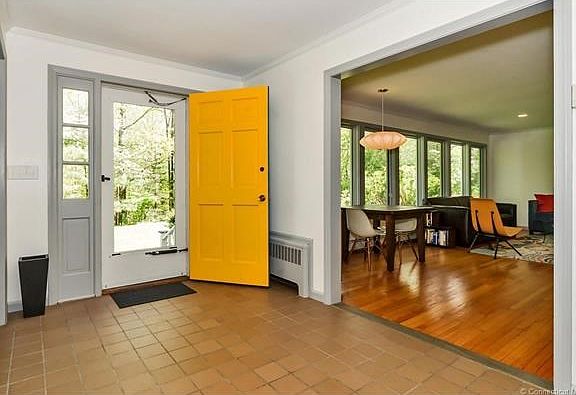 Tile entry leads into living room