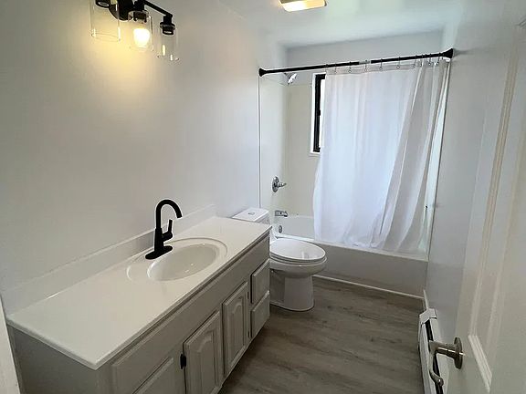 Completely remodeled bathroom with new vanity.