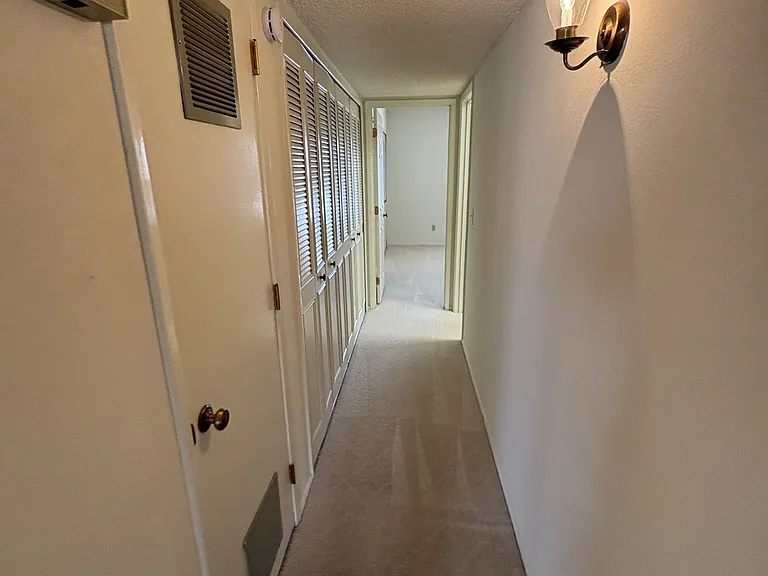 Hallway to bedroom two and guest bath