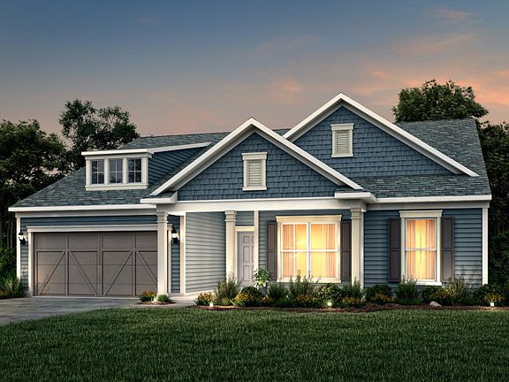 Amberwood Exterior 53 features Hardie Board siding, shakes, covered front porch and 2 car garage
