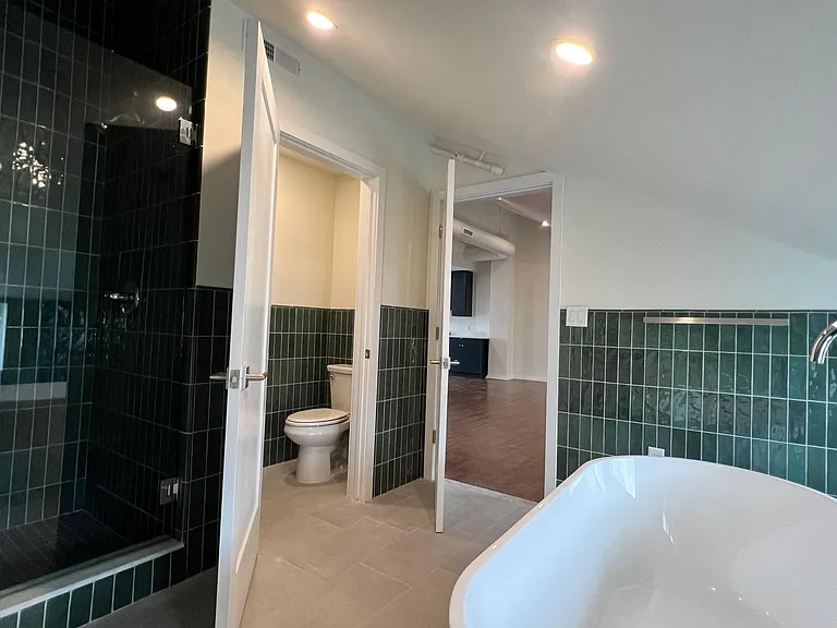 Deluxe Bath with soaking tub, walk in shower, double vanity and water closet.