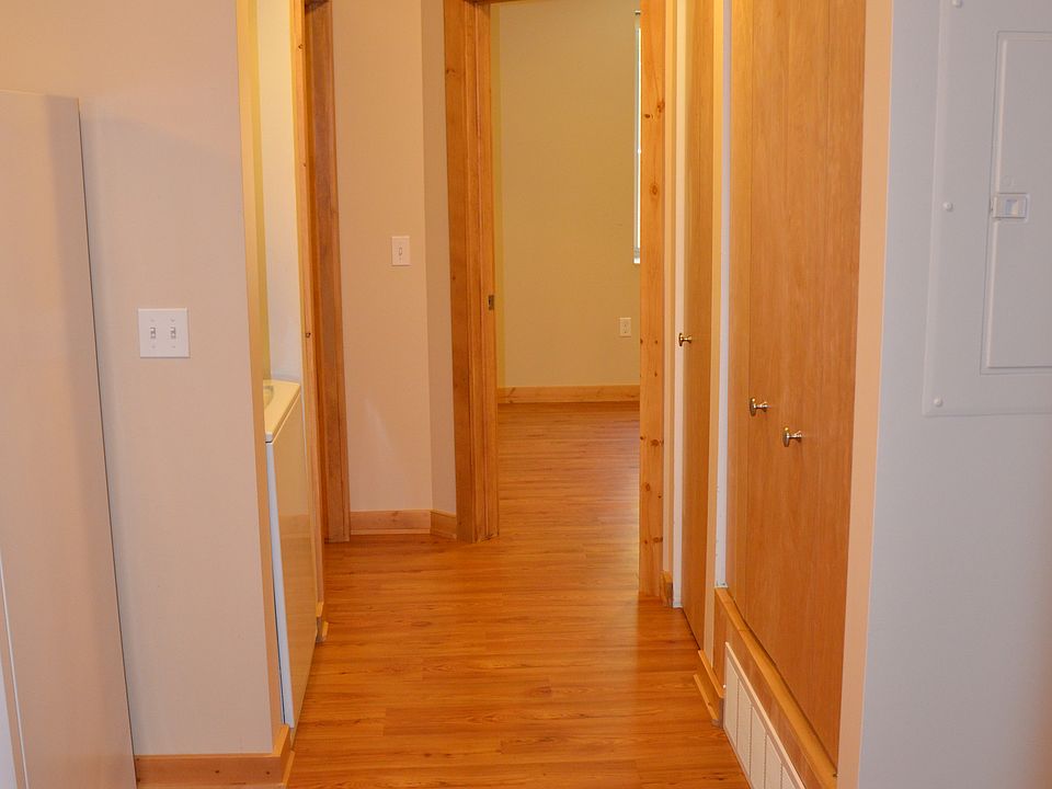 hall with laundry and storage closet