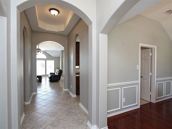 Lovely home has formal dining room with wood flooring, study, tiled den and kitchen and fresh paint throughout!