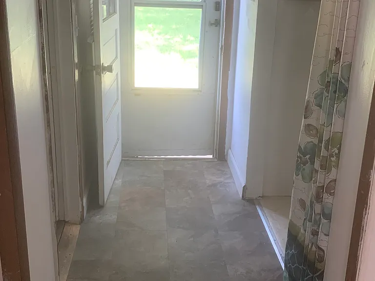 Hallway off Laundry Room and Back Door to The backyard
