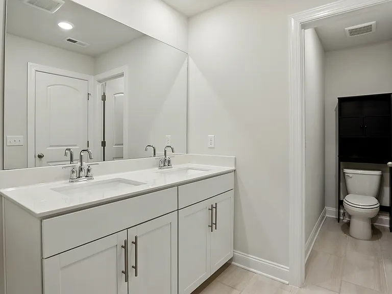 Master Bathroom - Spacious layout with updated fixtures and direct access to the En-suite.
