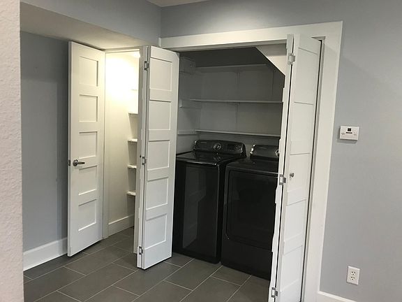 Separate lighted pantry. Convenient washer/dryer area