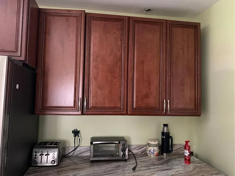 Functional kitchen counter area with ample upper cabinetry and convenient small-appliance prep space.